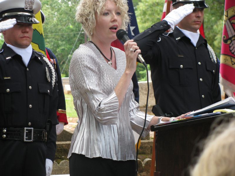 Laurie Rogers and two members of Nacogdoches Police Dept. Color Guard.